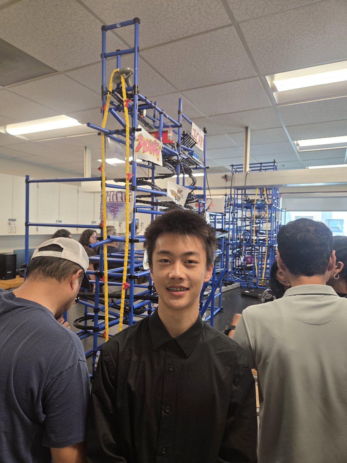 Rhoy Xu standing with the completed J-CAR sculpture